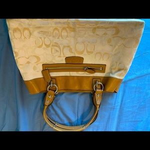 Tan and white Coach purse